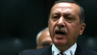 Turkey's Prime Minister Recep Tayyip Erdogan addresses members of his AK Party at the parliament in Ankara, 15 November.