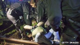 German police remove anti-nuclear waste protester from train tracks in Harlingen - 27 November 2011