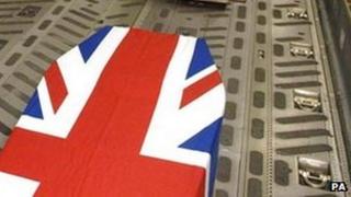 Coffin draped in Union Jack flag