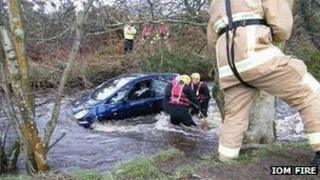 A man is rescued from a car in the River Neb
