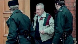 Father Brendan Smyth leaving court with two police officers