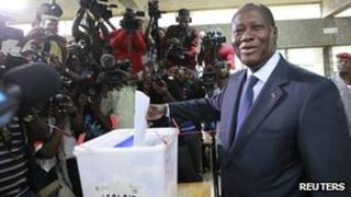 President Alassane Ouattara casts his ballot at a polling station in Cocody on 11 December 2011