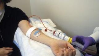 Woman receiving intravenous chemotherapy