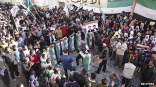 Demonstrators protesting against Syria"s President Bashar al-Assad gather during a march through the streets after Friday prayers in Baba Amro in Homs December 16, 2011.