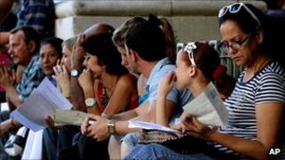 People queue outside the Spanish consulate in Havana, Cuba, to apply for Spanish citizenship