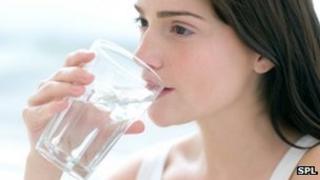 Woman drinking a glass of water