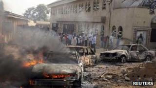 Burning car outside St Theresa Catholic Church at Madalla outside Abuja (25 Dec 2012)