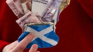 Scottish flag on purse with sterling notes