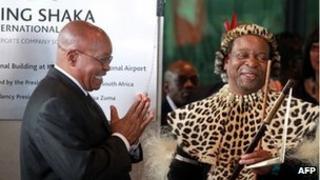 South African President Jacob Zuma (L) applauds Zulu King Goodwill Zwelithini (R) on 8 May 2010 after officially opening the Central Terminal building of Durban's new King Shaka International Airport and Dube Trade Port, north of Durban.