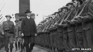 First Taoiseach of the Republic of Ireland Eamon de Valera inspects a guard of honour at O'Connell Street in Dublin