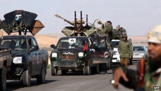 Libya's former rebels gather at a checkpoint near a mosque, outside Bani Walid on January 2012