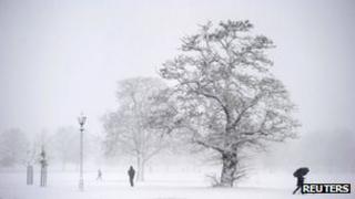 People walking in a snowy park