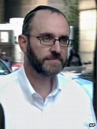 Menachem Youlus leaves federal court in New York after appearing on mail and wire fraud charges 24 August 2011