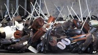 Handguns seized by police on the floor of the police armoury, Kingston, Jamaica. 7 Feb 2012
