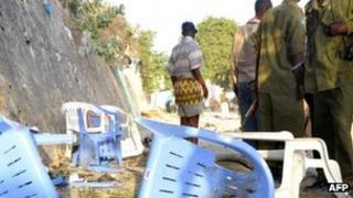 The body of a civilian lies on the ground near the site of a suicide car bomb attack in Mogadishu on 8 February 2012. A suicide bomber killed at least 10people in the war-torn Somali capital Mogadishu when he detonated an explosive-laden vehicle near the presidential palace, officials said