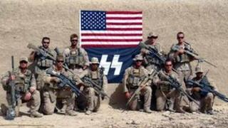 US Marines posing in front of flag bearing SS logo (Photo provided by Military Religious Freedom Organisation)