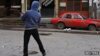 A gunman fires in Tripoli, Lebanon. Photo: 11 February 2012