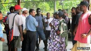 Relatives and friends of the passengers of the MV Rabaul Queen ferry that sank wait in Lae, Papua New Guinea 2 February, 2012