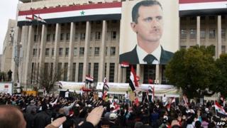 Supporters of President Bashar al-Assad attend a demonstration in central Damascus (15 February 2012)