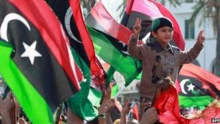 Libyans celebrate the capture of Saif al-Islam, fugitive son and one-time heir apparent of murdered leader Muammar Gaddafi, in the capital Tripoli on November 19, 2011.