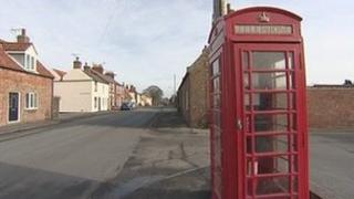 Phone box in village street