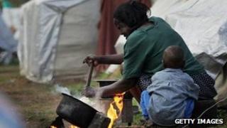 A Kenyan woman prepares ugali