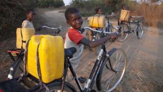 Boy with bicycle in Chongwe, Zambia