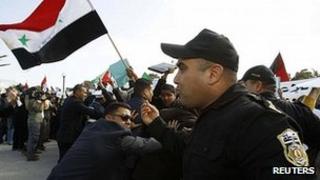 Syrian opposition protesters clash with police outside talks in Tunis. 24 Feb 2012