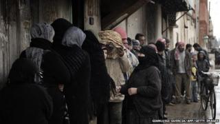 People queue for food 9 miles from Homs