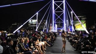 A model on Nelson Mandela Bridge during Africa Fashion Week, Feb 2011