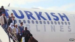 People disembarking from a Turkish Airlines flight on 6 March 2012 in Mogadishu, Somalia's capital