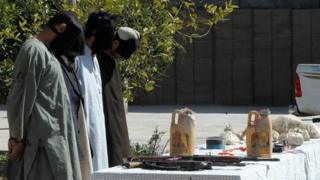 Taliban fighters stand blindfolded as they are presented to the media, after being captured by security forces, in Kandahar on March 5, 2012