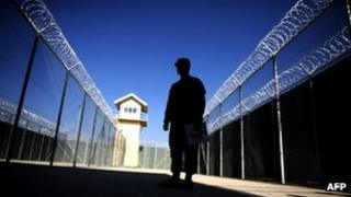 This file picture taken on November 15, 2009 shows a US captain silhouetted as he looks on during a media tour of Bagram prison, north of Kabul.