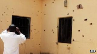 Bullet holes in the building where the men were held