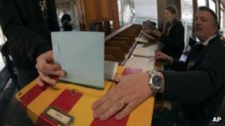 A man votes in Carouge, Switzerland