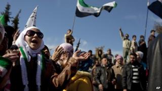 A woman chants a slogan during an anti-government protest in northern Syria (2 March 2012)