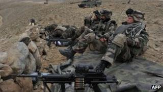 French soldiers of the battle group Picardie keep watch during an operation in Usbeen village, in Surobi district of Kabul province on March 15, 2012