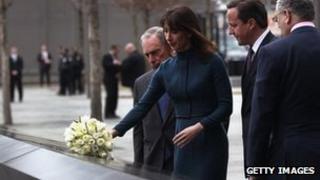 Samantha Cameron, accompanied by her husband David, lays flowers at the World Trade Center Memorial