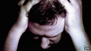 Man holding head