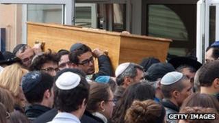 Coffin being moved from Toulouse school