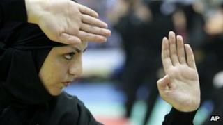 Member of a group of female Iranian ninjutsu athletes trains in Karaj, west of the capital Tehran, on 15 March 2012