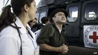 Handout photo released by the International Committee of Red Cross (ICRC) of former FARC hostage Cesar Augusto Lasso Monsalve (right)