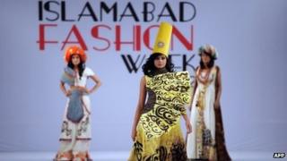 A model presents a creation by Fashion Era on the second day of the Islamabad Fashion Week at the Pak-China Friendship Center in Islamabad on April 11, 2012.