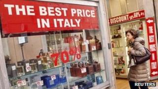 Woman outside perfume shop in Rome