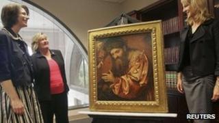 Officials and legal representation of the family of Federico Gentili di Giuseppe stand next to the painting by Italian artist Girolamo de Romani 18 April 2012
