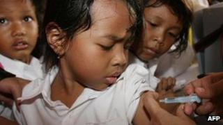Child being immunised