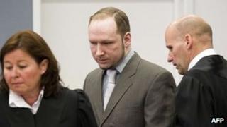 Anders Behring Breivik arriving in court with his lawyers