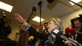 French National Front leader Marine Le Pen speaks to reporters in Nanterre, north-west of Paris, 23 April