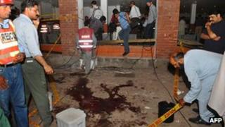 Rescue workers at the scene of the Lahore blast