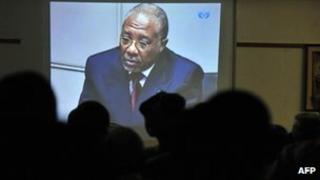 People watch the trial of Liberian ex-leader Charles Taylor on screen inside the Special Court for Sierra Leone in Freetown